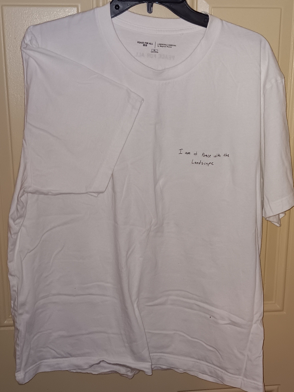 Uniqlo White Crewneck T-Shirt with Subtle Chest Script